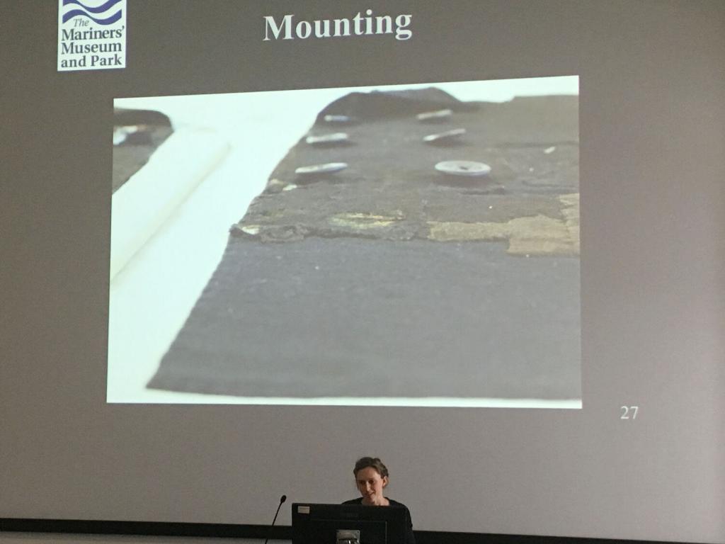 Elsa Sangouard, The Mariners’ Museum and Park, discusses the backing used to support a wool coat from the USS Monitor before it goes on display in the museum.