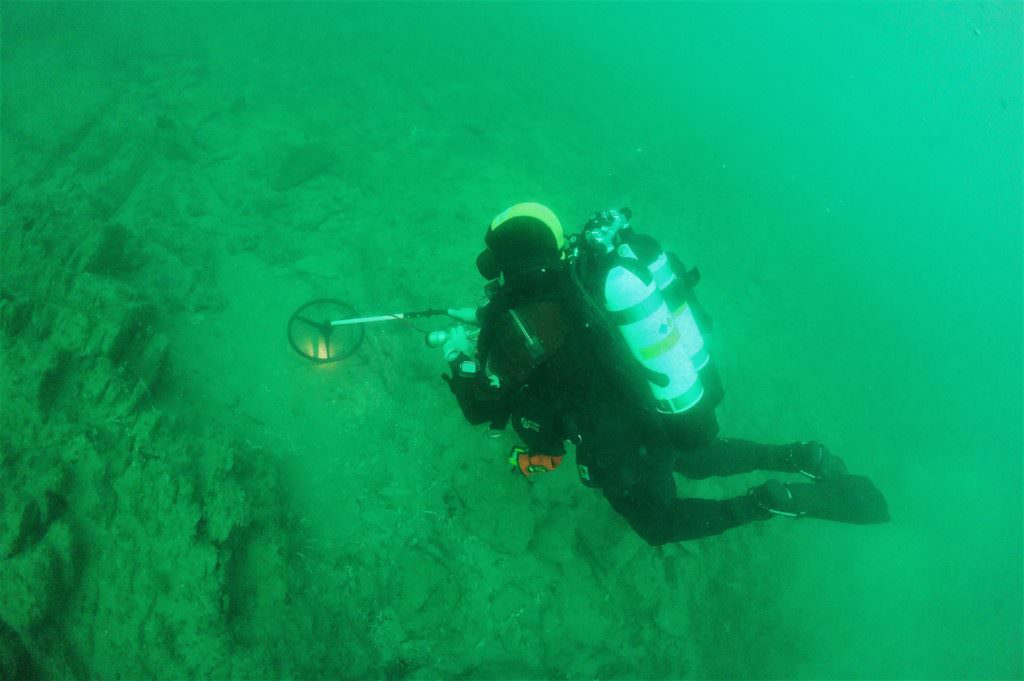 coronation wreck project diver with metal detector