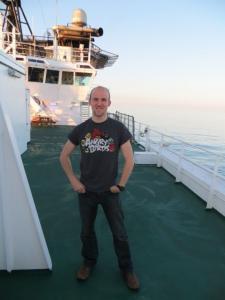 Adam Bolton 2019 student award winner standing on deck of ship