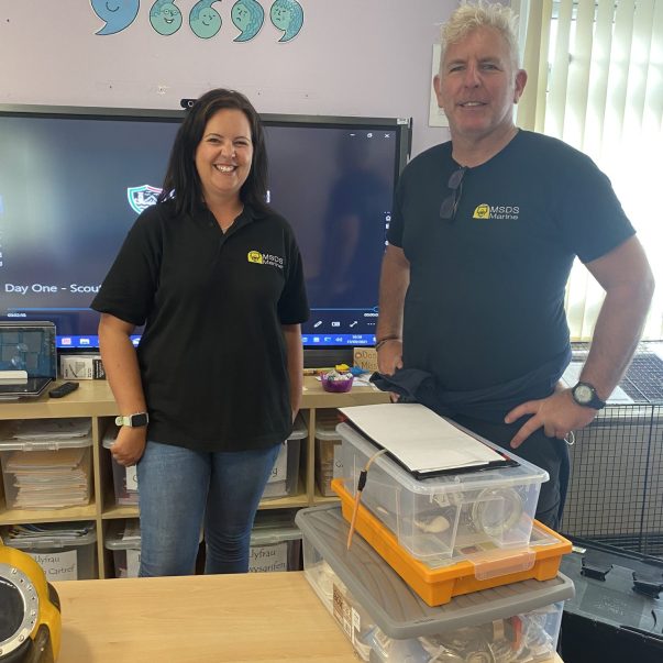 Two of the MSDS Marine team during a school visit stood in the classroom